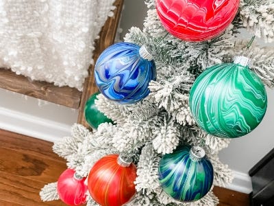 red, green, blue, and orange colored ornaments hanging from tree