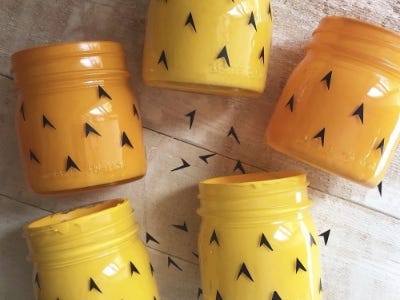 little black arrows added to 5 yellow jars