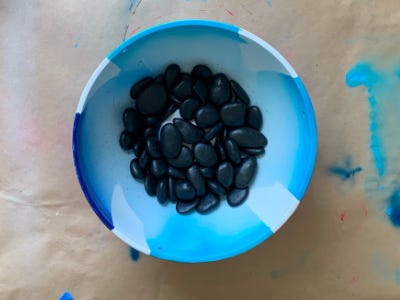 small rocks sitting into the bottom of pot