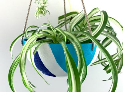 blue teal and white pot hanging with white background