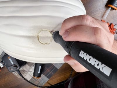 using rotary tool to cut small circle into pumpkin