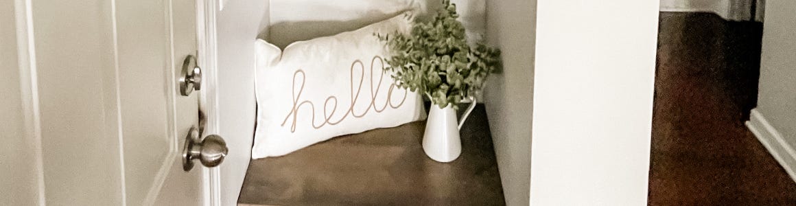 Shelf Plank Wall Hero DIY buil-in shelf plank wall holding pillow and plant vase