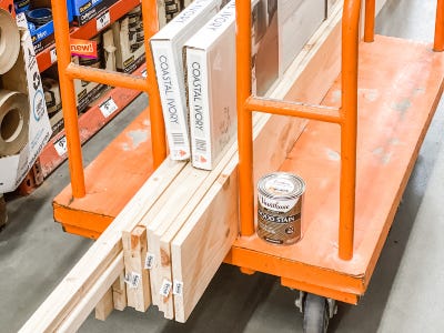 wood pieces on orange moving cart 