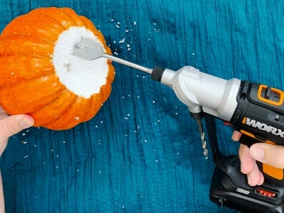 using drill to clean out inside pumpkin