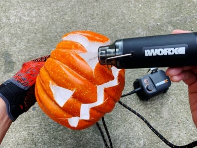 use heat gun to melt orange pumpkins eye