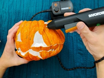 using glue gun to reform pumpkin