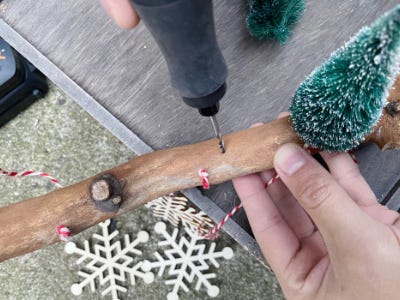 drilling another hole next to Christmas tree