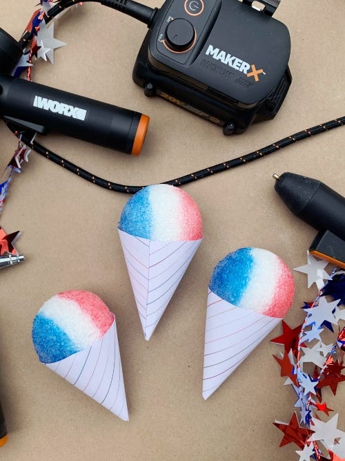 styrofoam snow cones colored red, white, and blue on a table