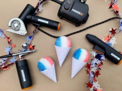 3 red, white, and blue snow cone magnets laid out on table next to worx tools