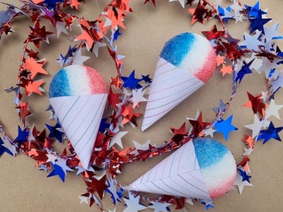 3 red, white, and blue snow cone magnets laid out on table next to stars