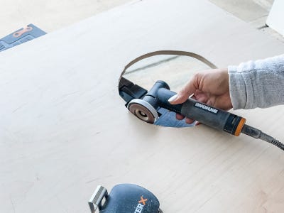 grinder tool sanding the edges of the circle