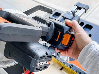 inserting worx battery into cutting saw for power