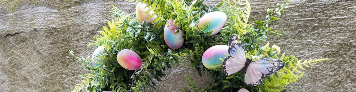 tie dye easter egg wreath hanging on wall