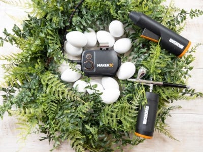 blank wreath on a table piled with eggs and the makerx tools