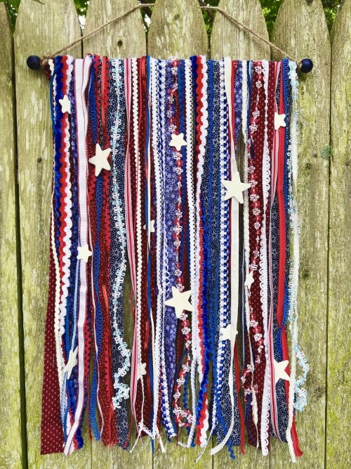 finished boho American flag hanging on a fence 