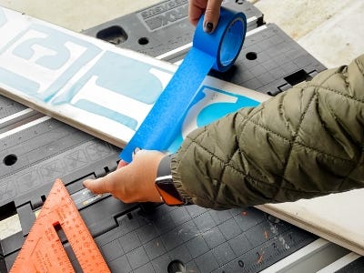 applying painters tab to stencils and wood 