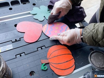 using the towel to weather the 4 colored eggs and pumpkin and heart 