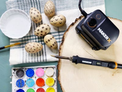 wood engraving next to wood burned eggs and paint