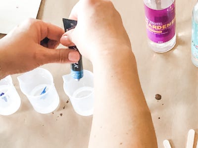 Squeezing paint into resin filled pouring cup