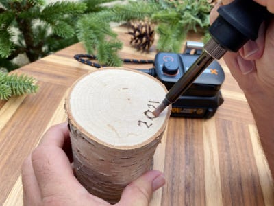 wood burning tool used to etch 2021 into bottom of wood