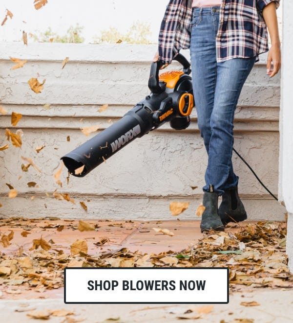 clickable image a person using the WG509 Worx Trivac to blow leaves from the sidewalk