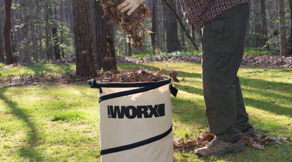 image of a man adding leaves to the collapsible bin