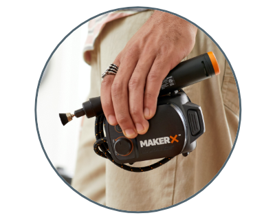 person carrying the rotary tool and the makerx hub in their left hand