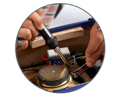 image of a person using the crafter to solder electrical component parts