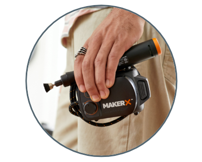 image of a person holding the rotary tool and makerx hub