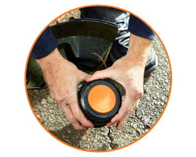 close up image of a person attaching the trimmer head