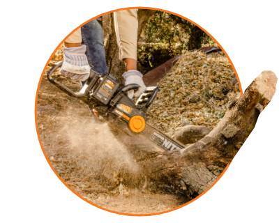 person using the chainsaw to cut a log