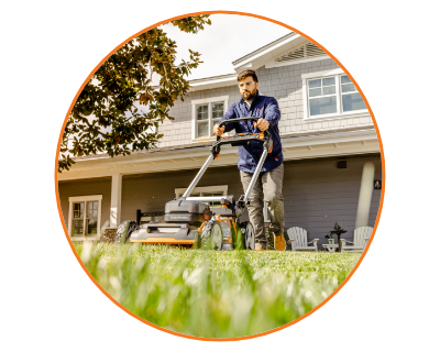 man mowing the lawn with the mower