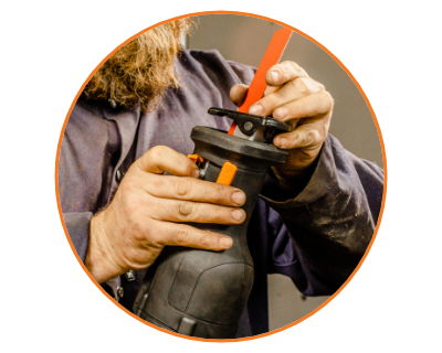 man changing the blade on the saw