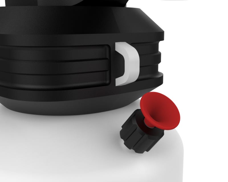 close up of the red pressure release valve with the black air compressor