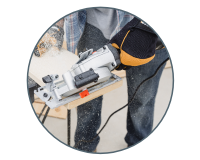 image of a person cutting wood using the saw 