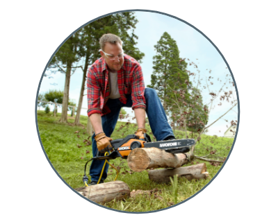 man using the chain saw to cut a log