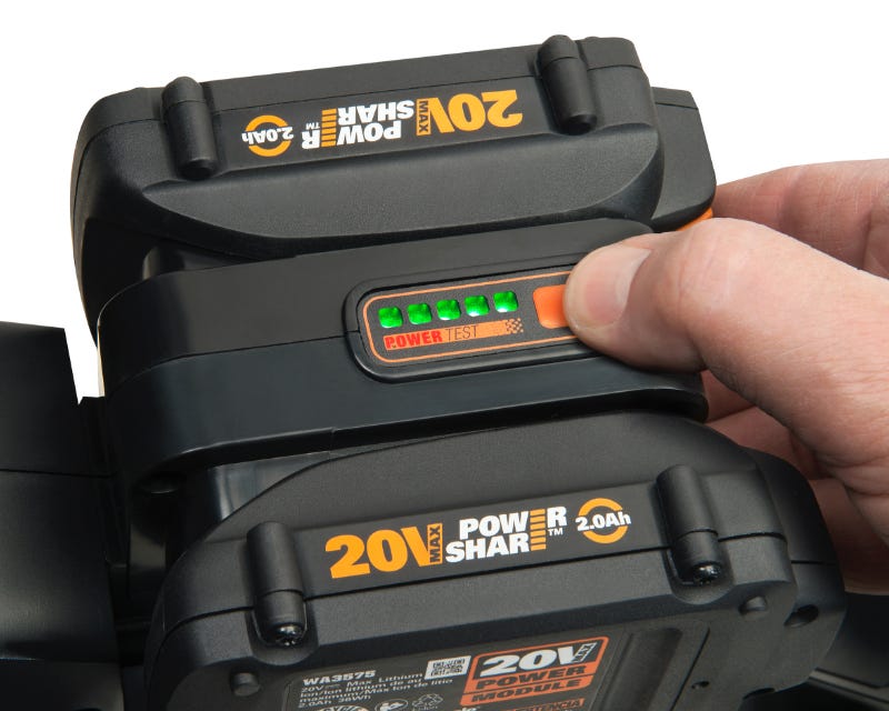 close up image of a person pressing the battery indicator button on the power share battery