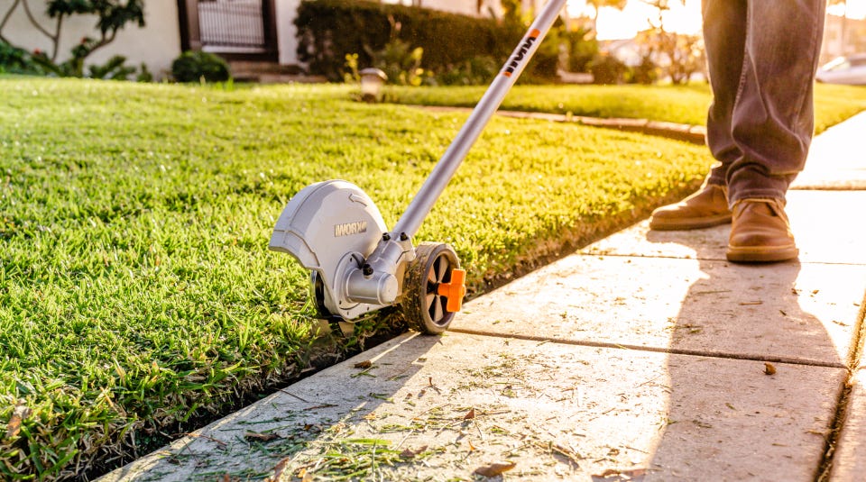 image of a person using the trimmer as an edger