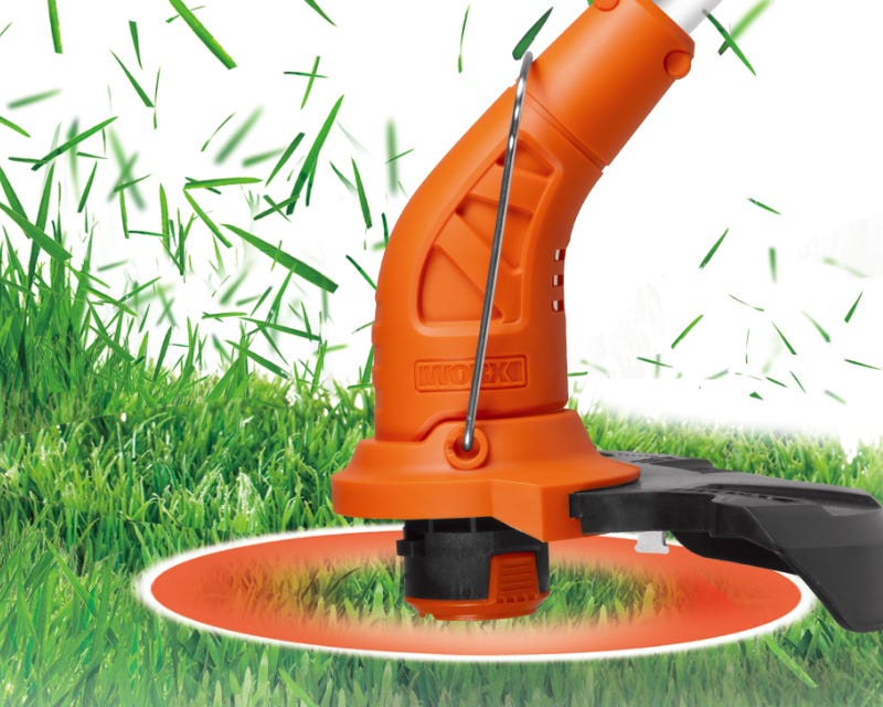 simulated image of the trimmer head with the line spinning and cutting grass